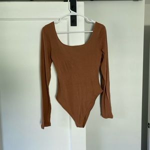Ozma silk bodysuit in terracotta